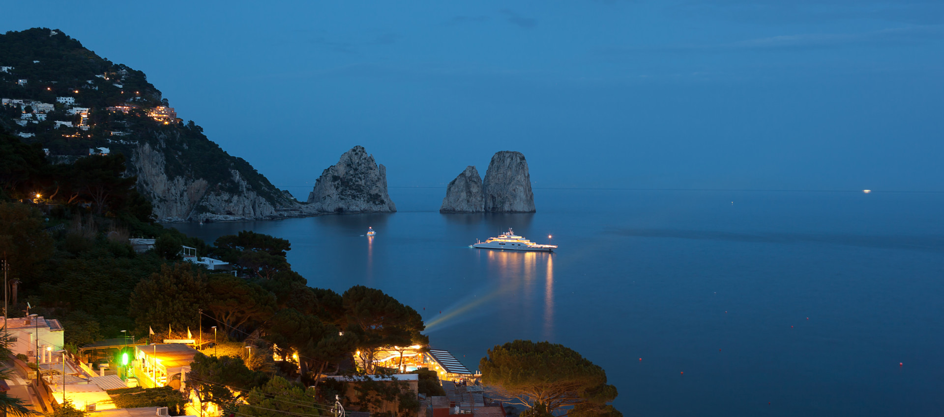 Faraglioni by night, famous giant rocks, Capri island