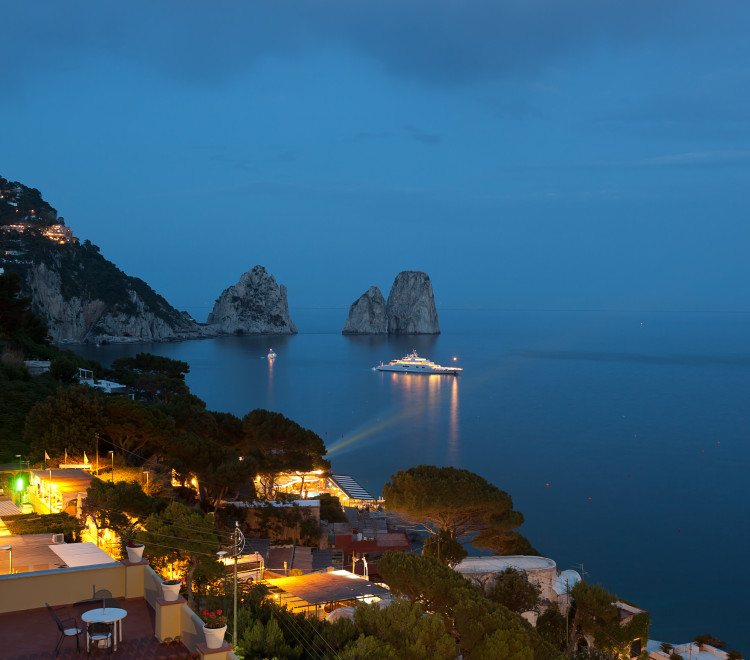 Faraglioni by night, famous giant rocks, Capri island